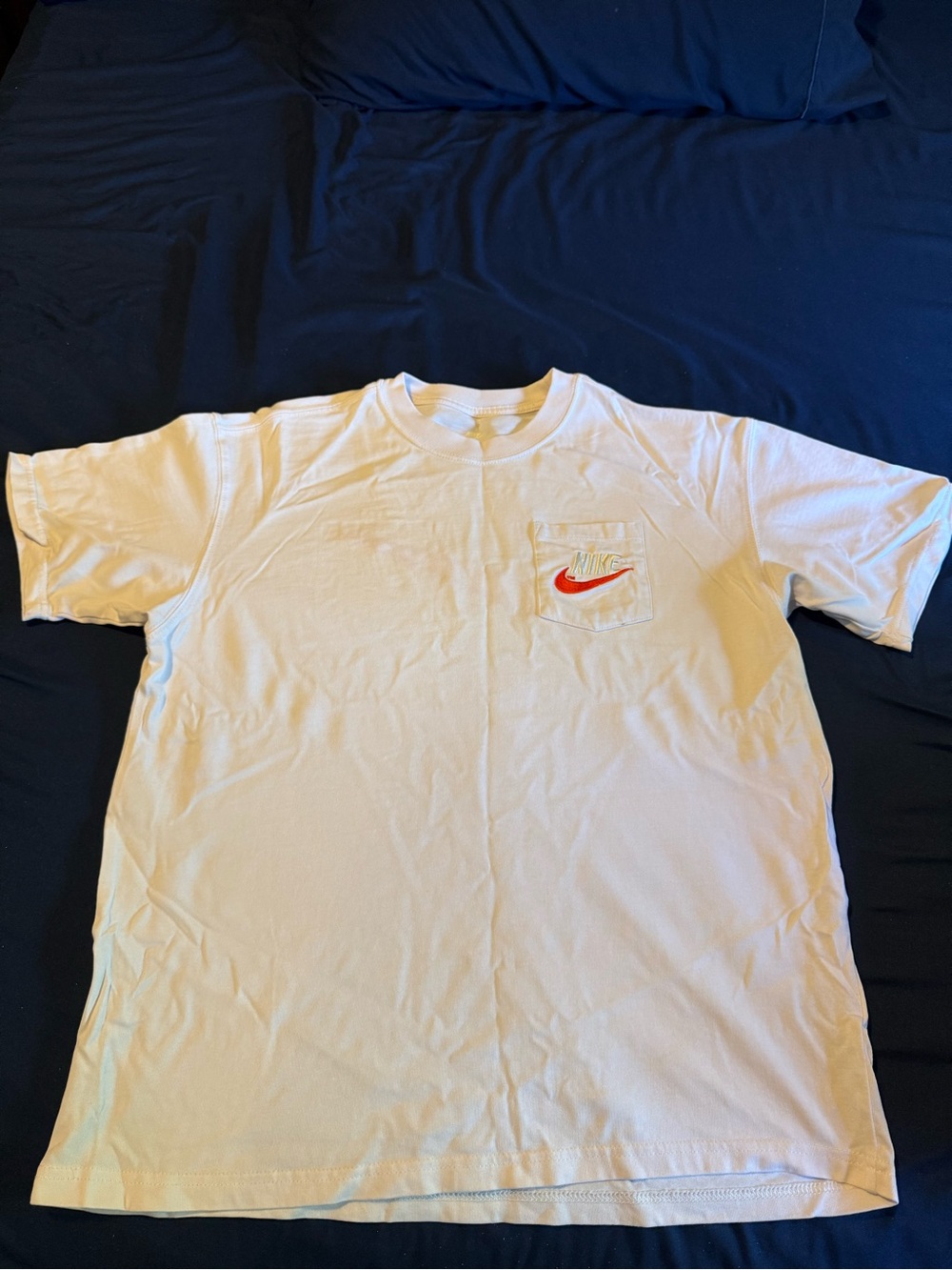 Nike Men’s White Short Sleeve Pocket Tee with Red Swoosh